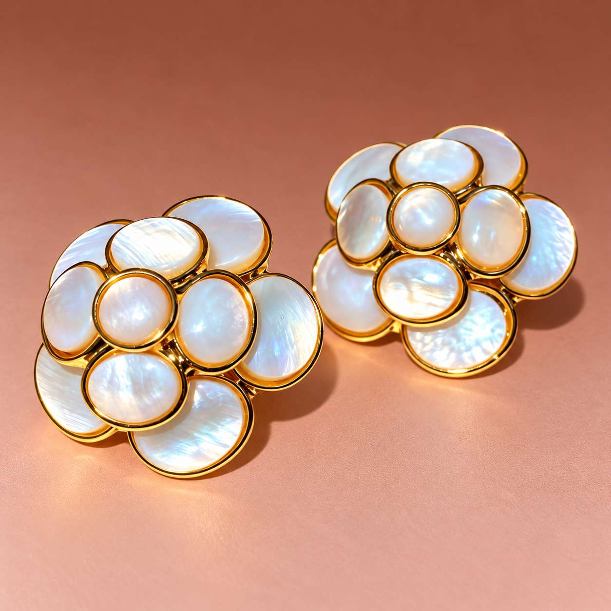 Pair of flower-shaped mother-of-pearl earrings with gold-tone settings